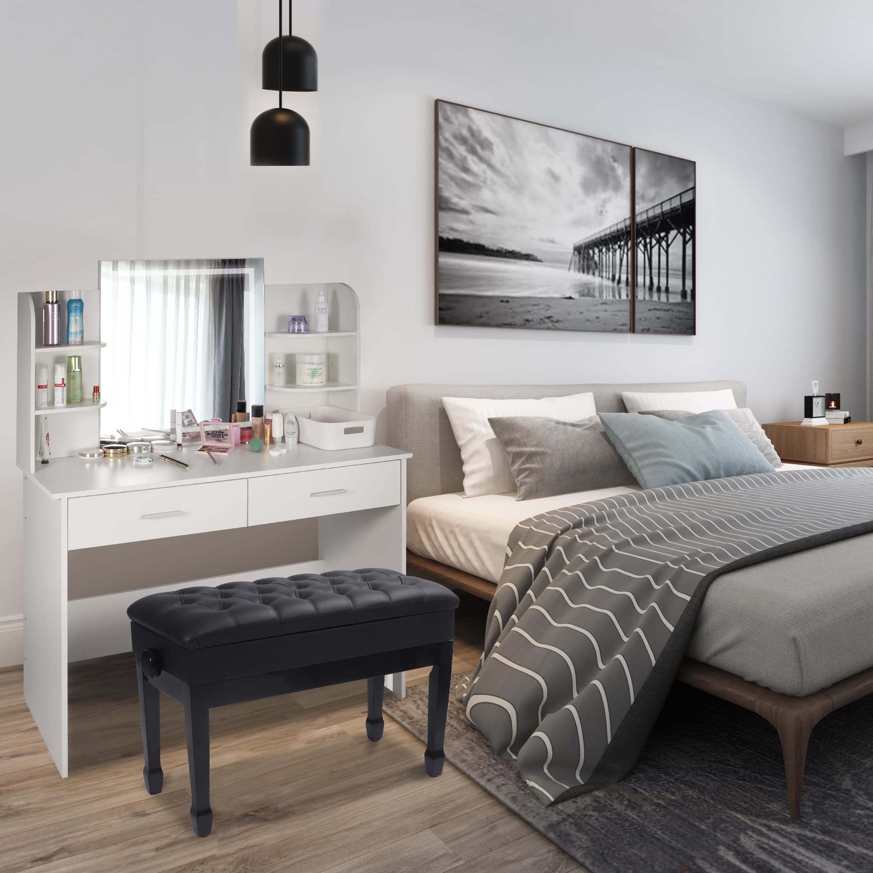 Modern bedroom with a bed, vanity, and artwork on the wall.